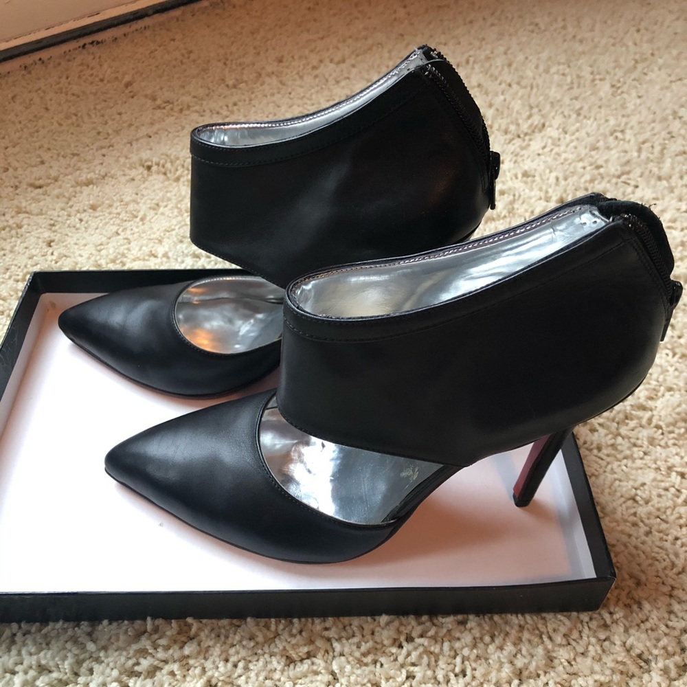 Black Argentinian leather shoes with red soles!
